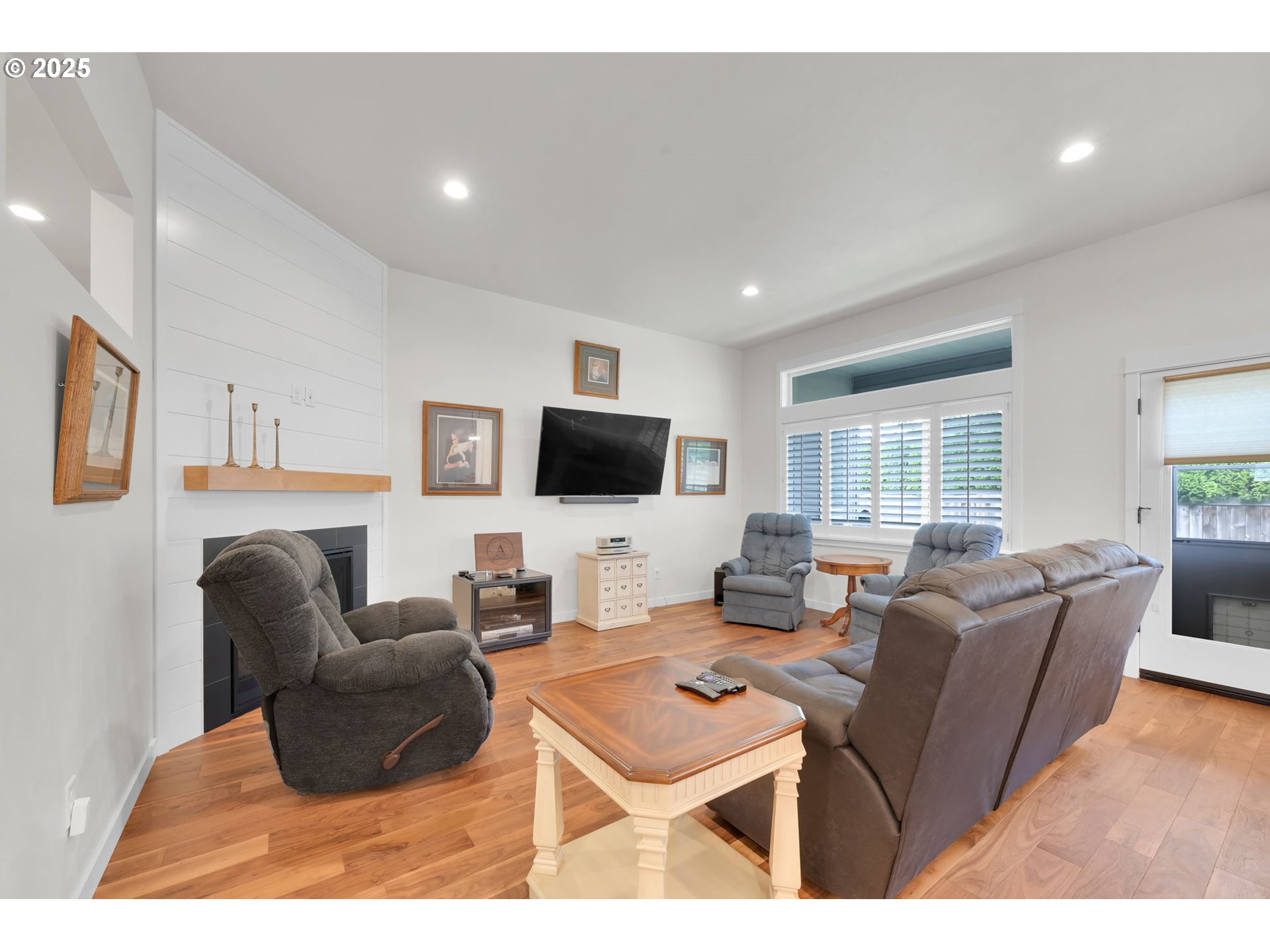 970 Lupine Street Springfield, OR 97477 - Photo 21 of 47 a living room with furniture a flat screen tv and a window