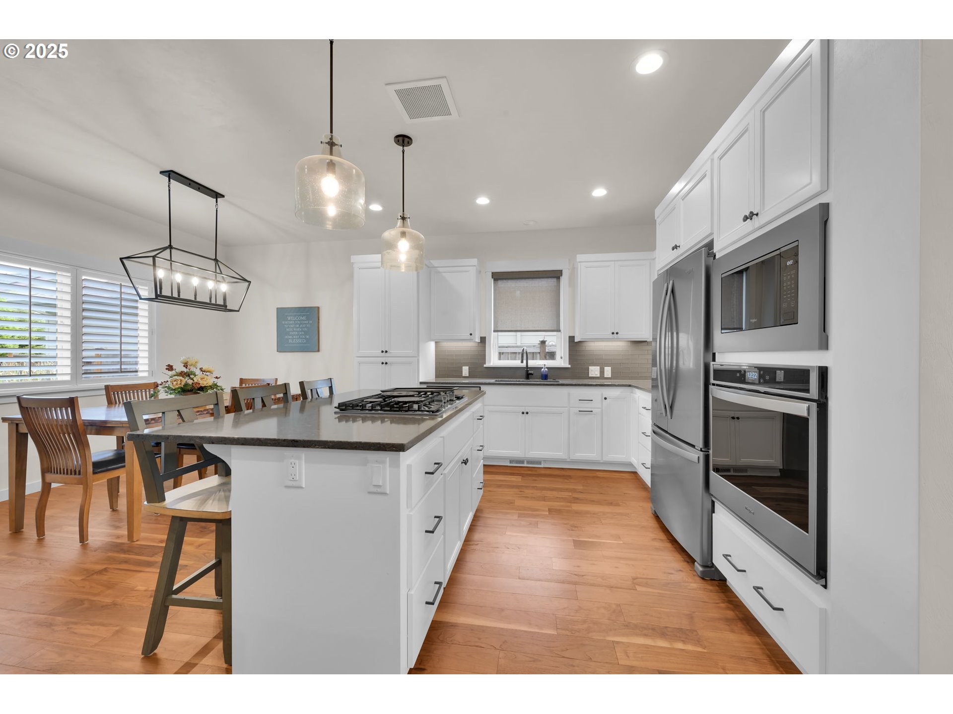 970 Lupine Street Springfield, OR 97477 - Photo 22 of 47 a kitchen with stainless steel appliances kitchen island granite countertop a sink a stove and cabinets