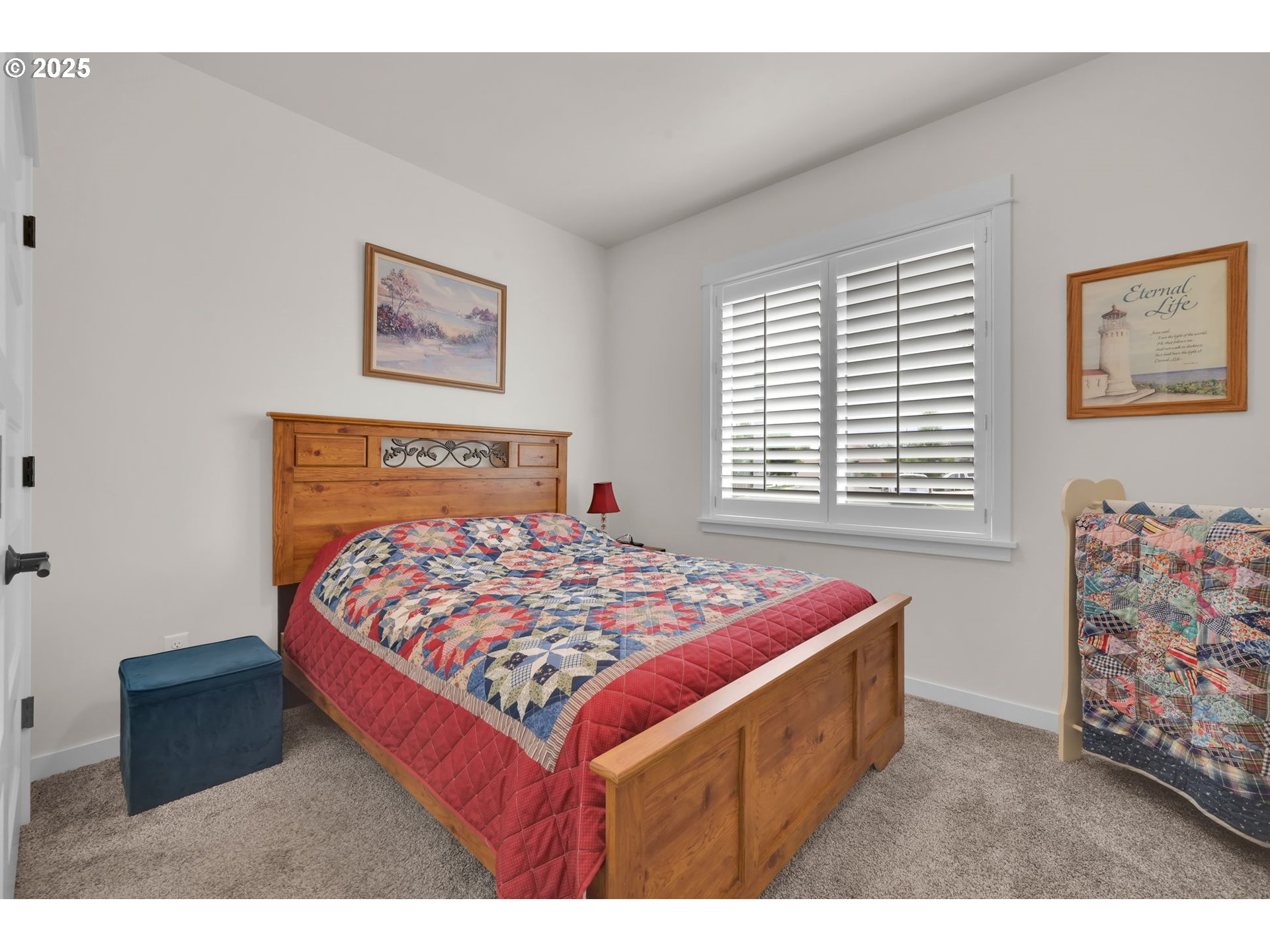 970 Lupine Street Springfield, OR 97477 - Photo 28 of 47 a bed sitting in a bedroom next to a window