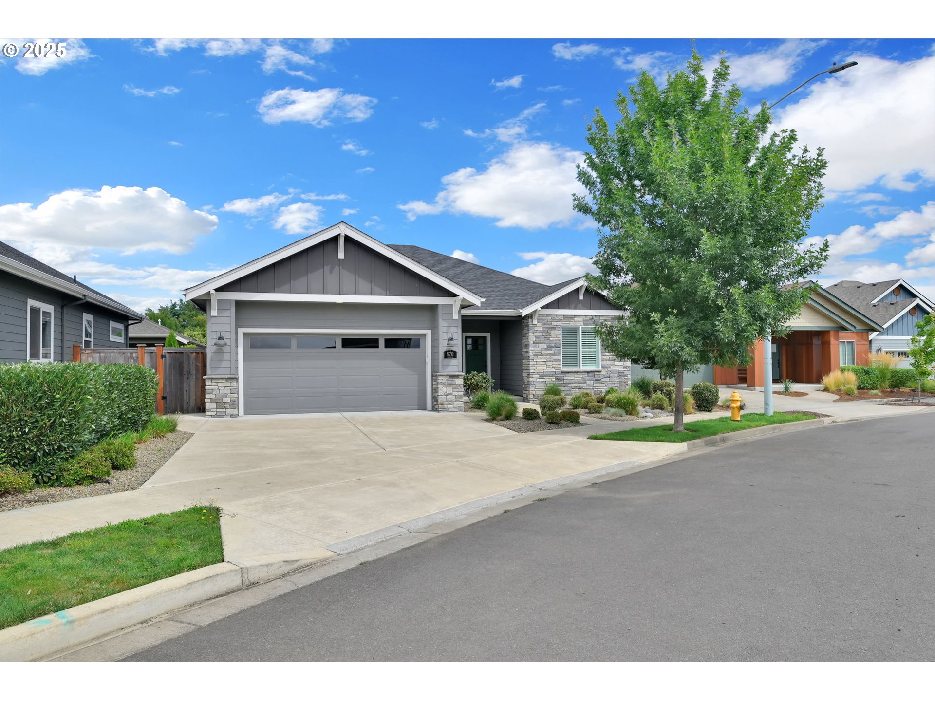970 Lupine Street Springfield, OR 97477 - Photo 3 of 47 a front view of a house with a yard and garage