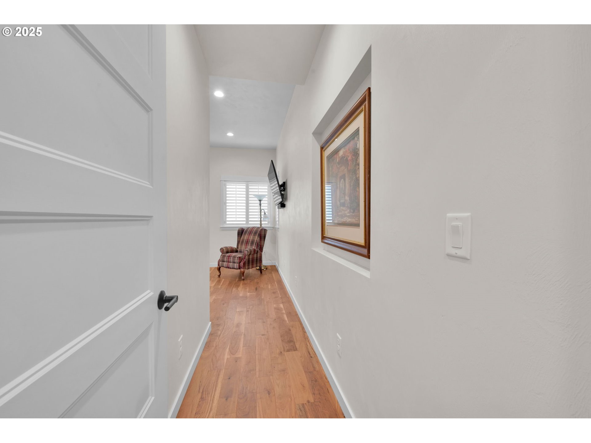 970 Lupine Street Springfield, OR 97477 - Photo 38 of 47 a hallway with a large mirror and wooden floor