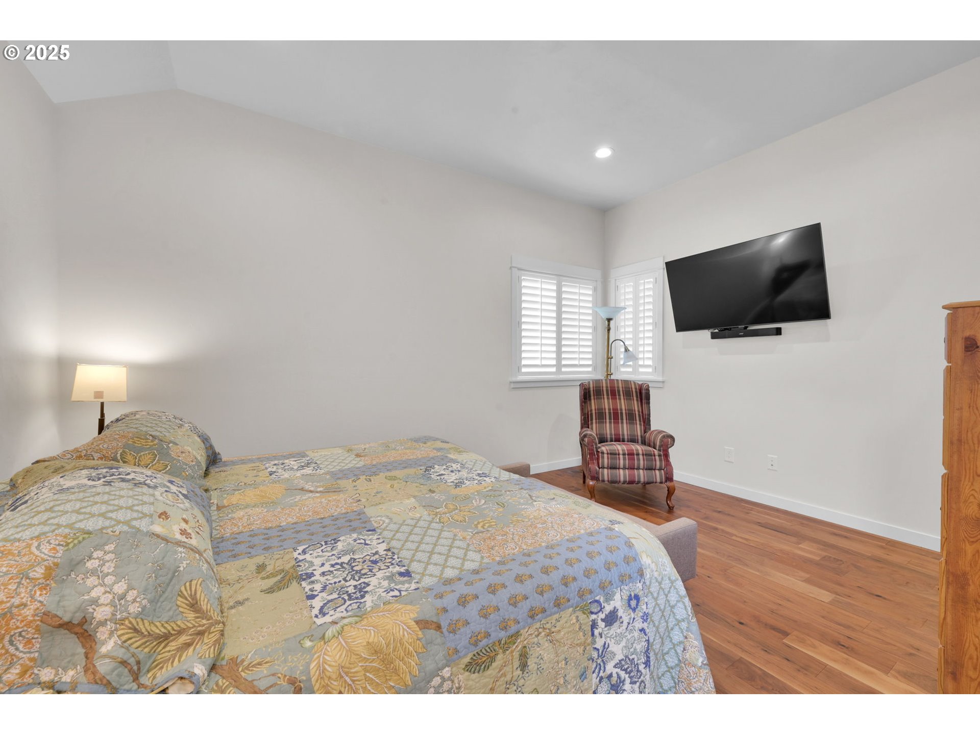 970 Lupine Street Springfield, OR 97477 - Photo 39 of 47 a bedroom with a bed and a flat screen tv