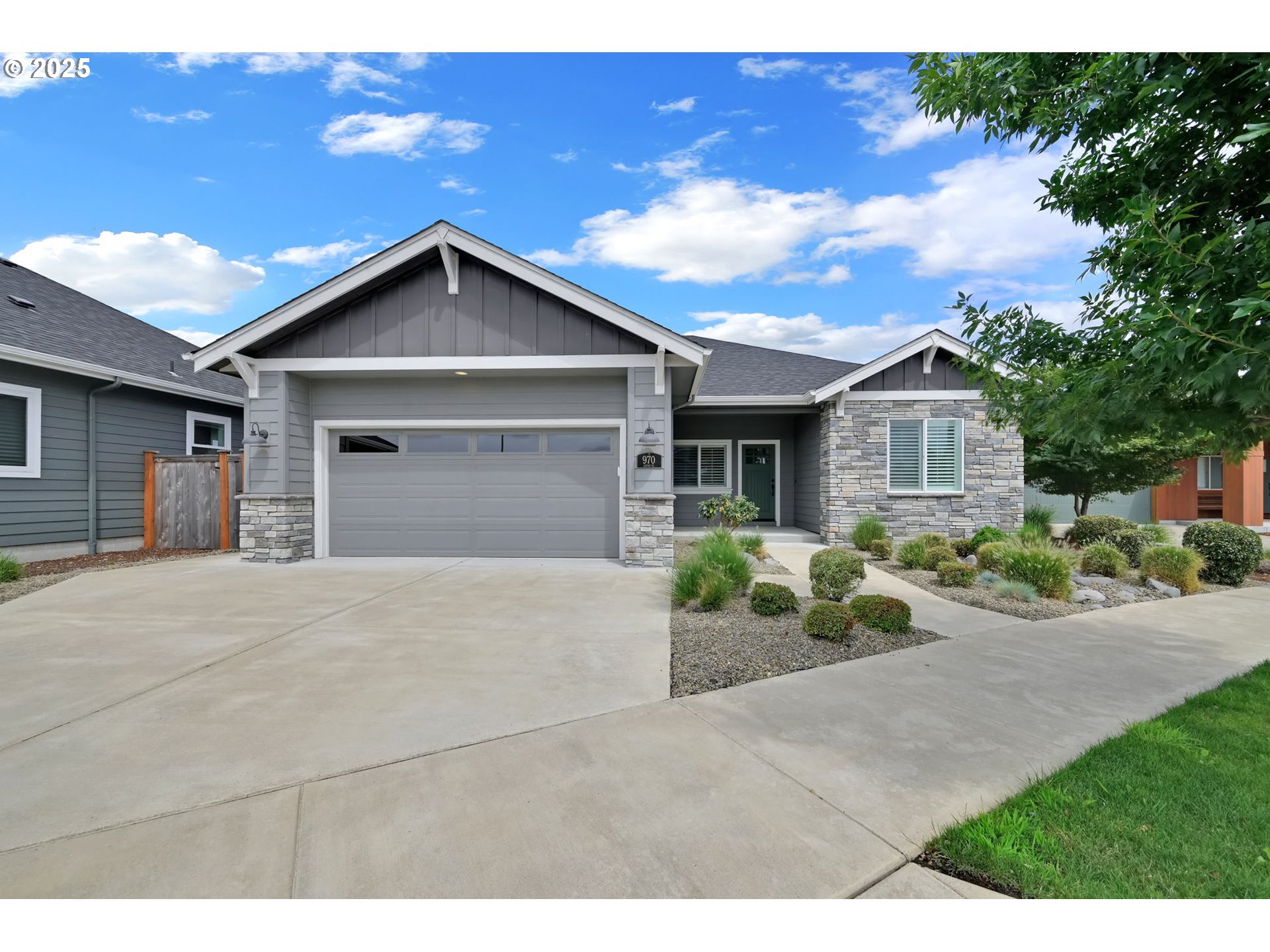 970 Lupine Street Springfield, OR 97477 - Photo 4 of 47 a front view of a house with a yard and garage