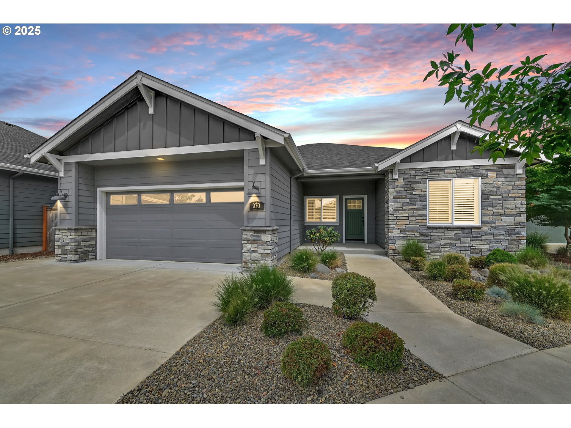 970 Lupine Street Springfield, OR 97477 - Photo 47 of 47 a front view of a house with a yard and garage