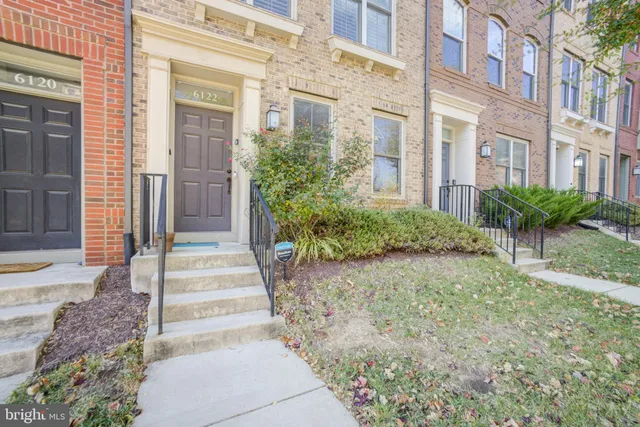 a view of a pathway both side of house