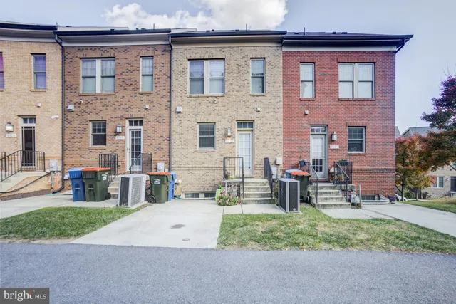 front view of house with a yard and table and chairs