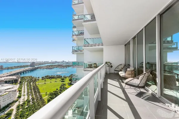 a view of a swimming pool with seating area