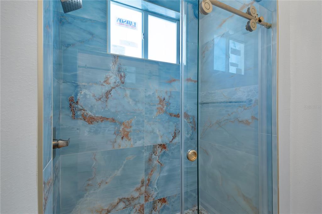 4869 Northwest 101st St Road Ocala, FL 34482 - Photo 27 of 48 guest bath intriguing custom tile!