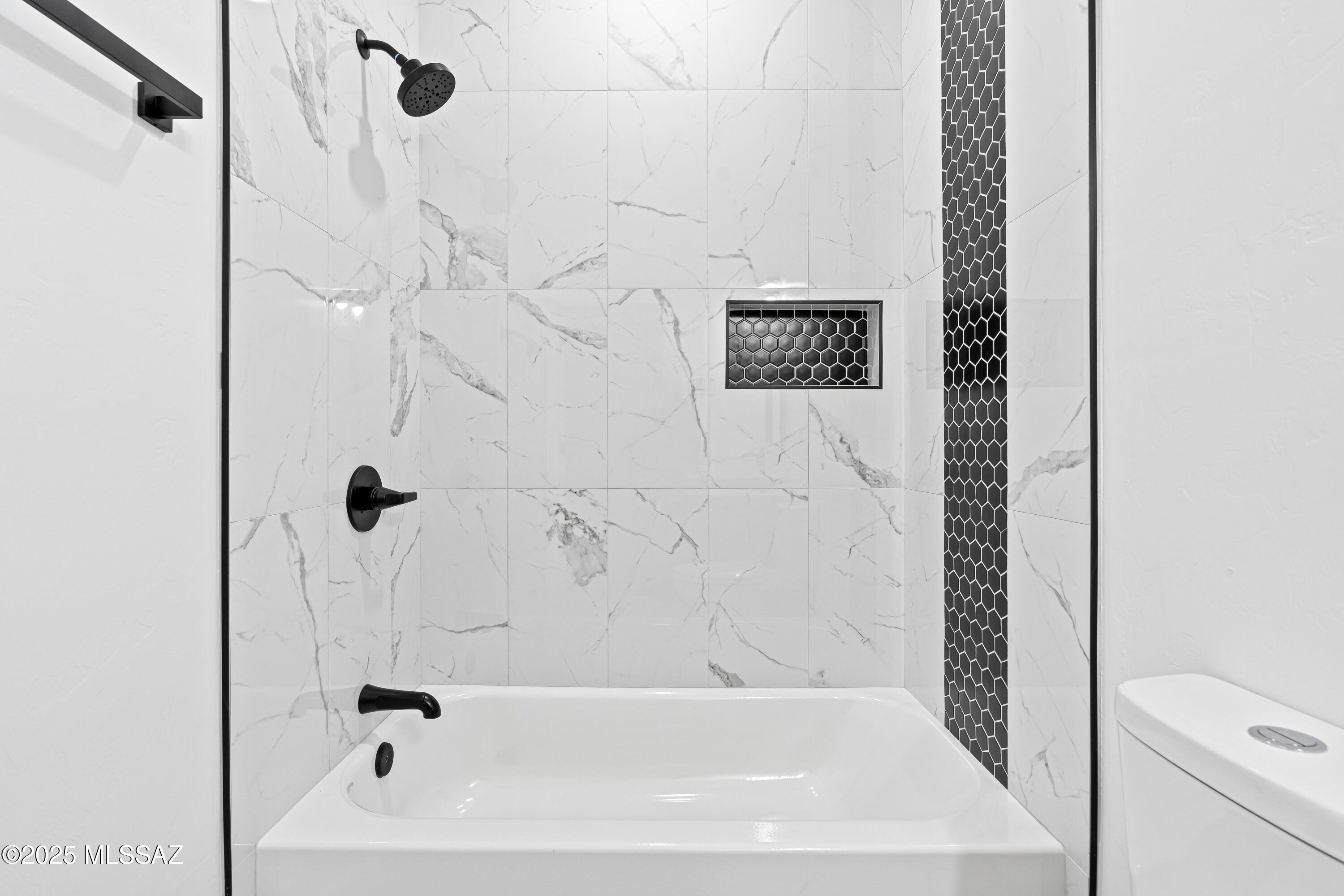 1560 Pinguinos Court Rio Rico, AZ 85648 - Photo 18 of 33 a bathroom with a bathtub and shower