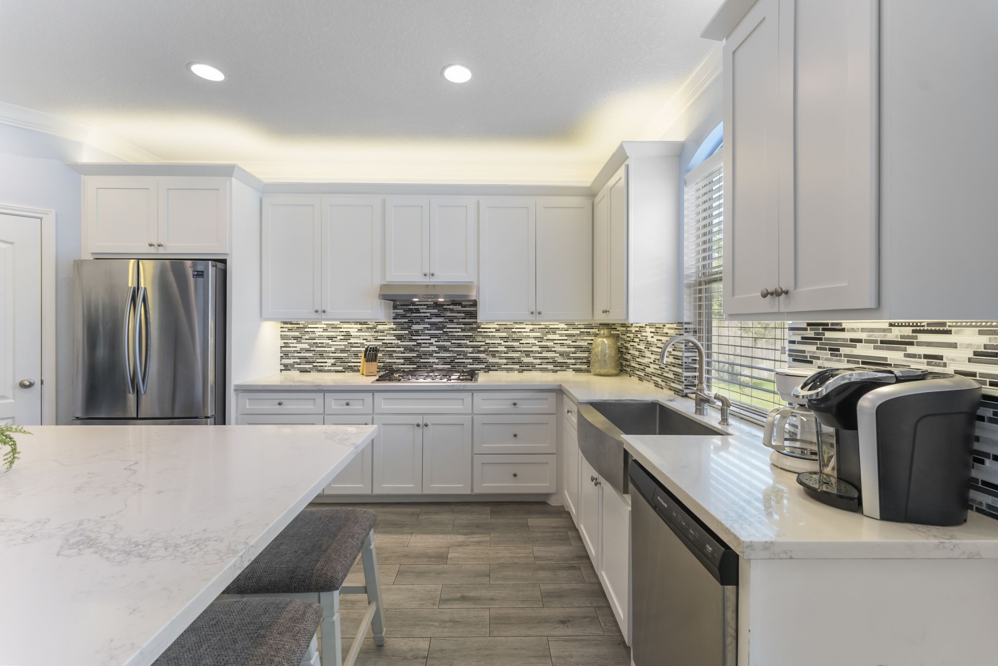 119 Wood Drake Place Tomball, TX 77375 - Photo 11 of 47 a kitchen with a refrigerator and a sink