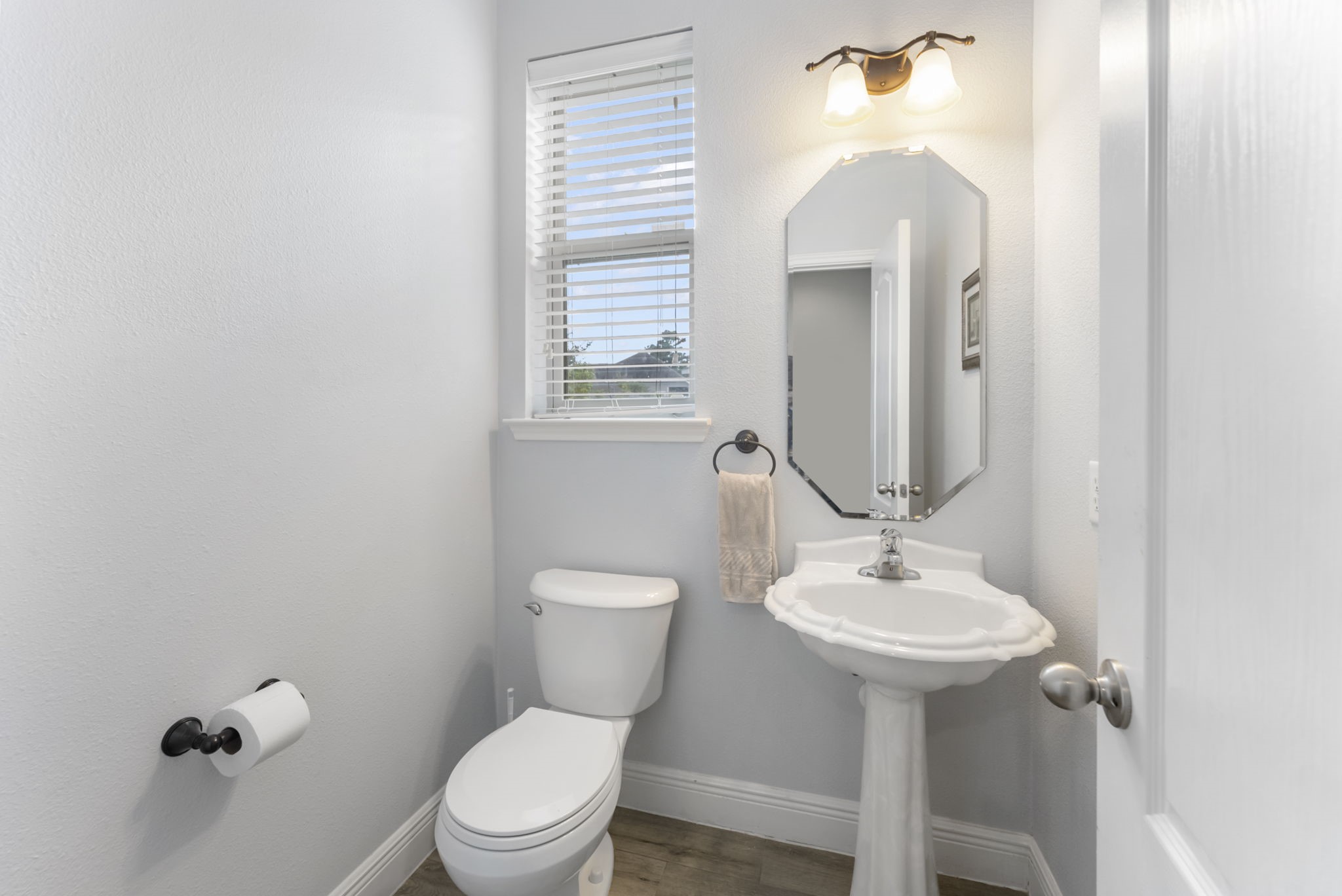 119 Wood Drake Place Tomball, TX 77375 - Photo 21 of 47 a bathroom with a toilet sink and mirror