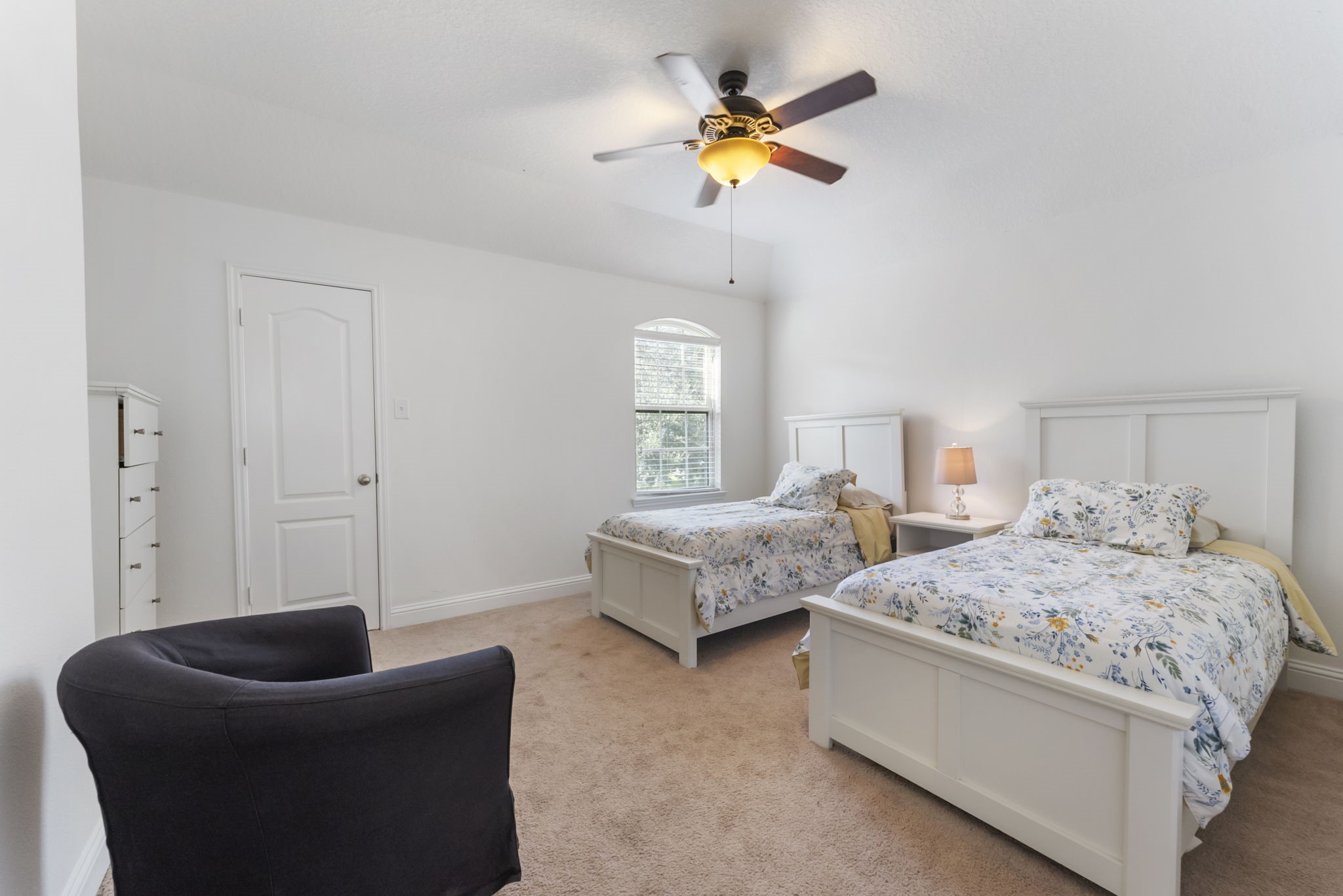 119 Wood Drake Place Tomball, TX 77375 - Photo 28 of 47 a bedroom with a bed couch and window