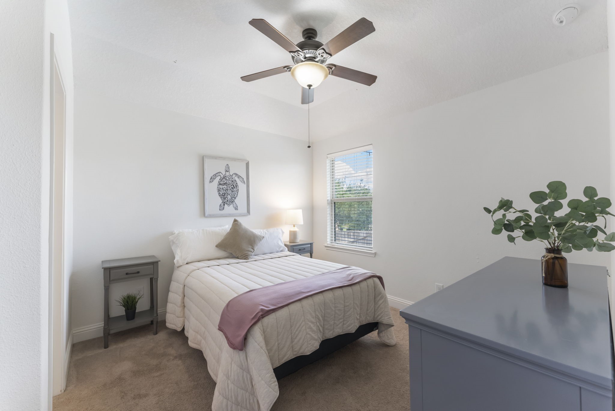 119 Wood Drake Place Tomball, TX 77375 - Photo 32 of 47 a bedroom with a bed and a potted plant