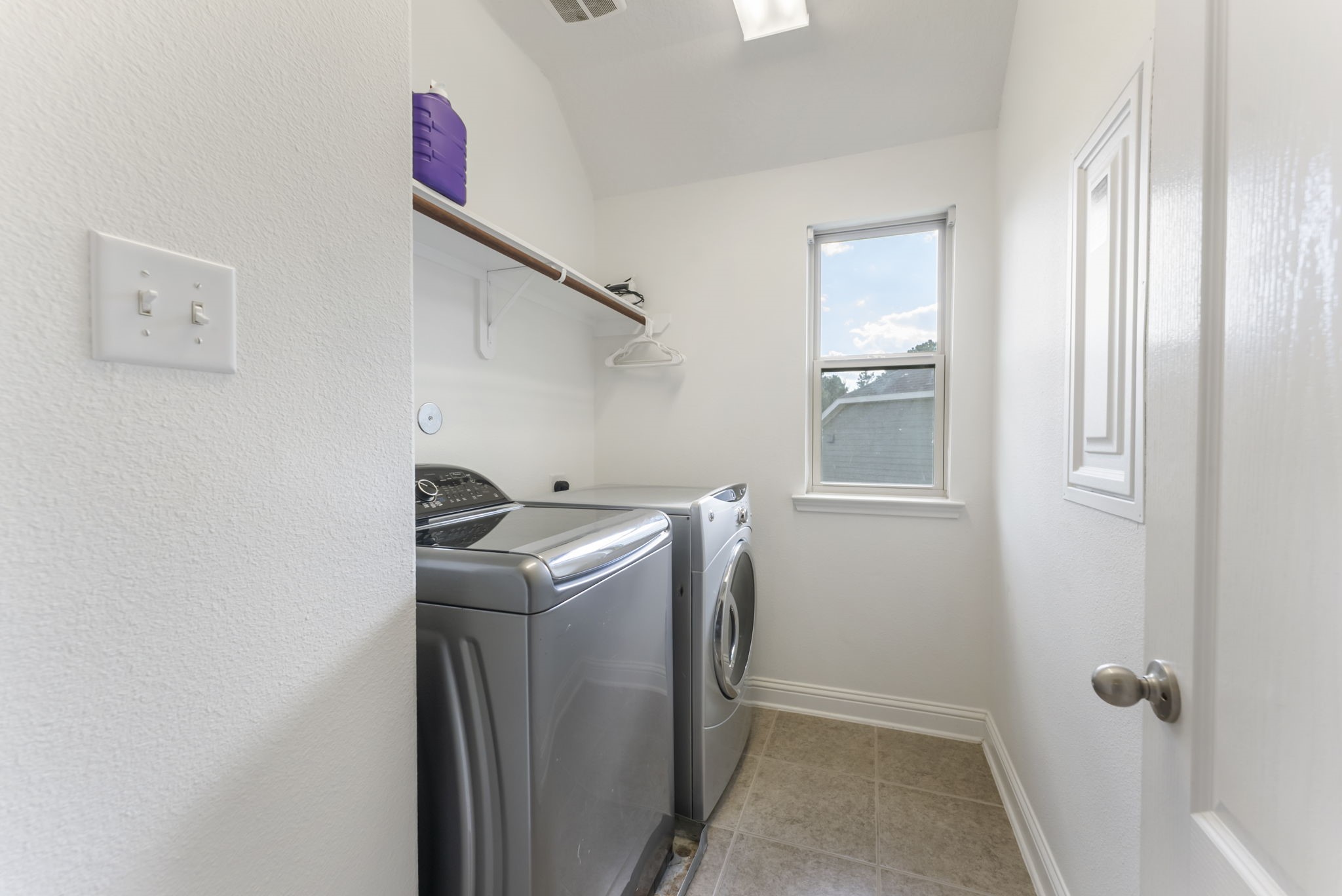 119 Wood Drake Place Tomball, TX 77375 - Photo 34 of 47 a utility room with a window dryer and washer
