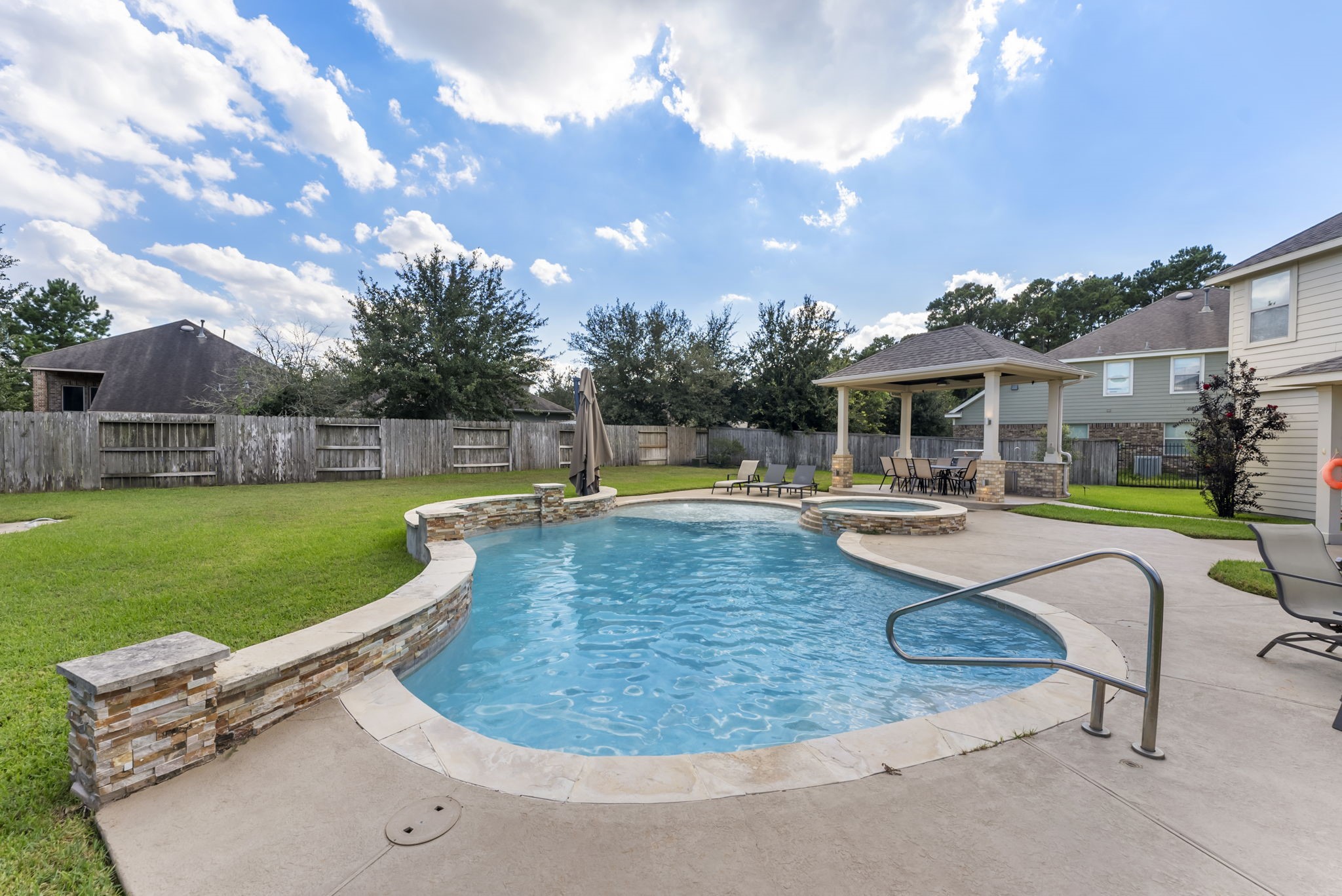 119 Wood Drake Place Tomball, TX 77375 - Photo 38 of 47 a swimming pool with outdoor seating and yard