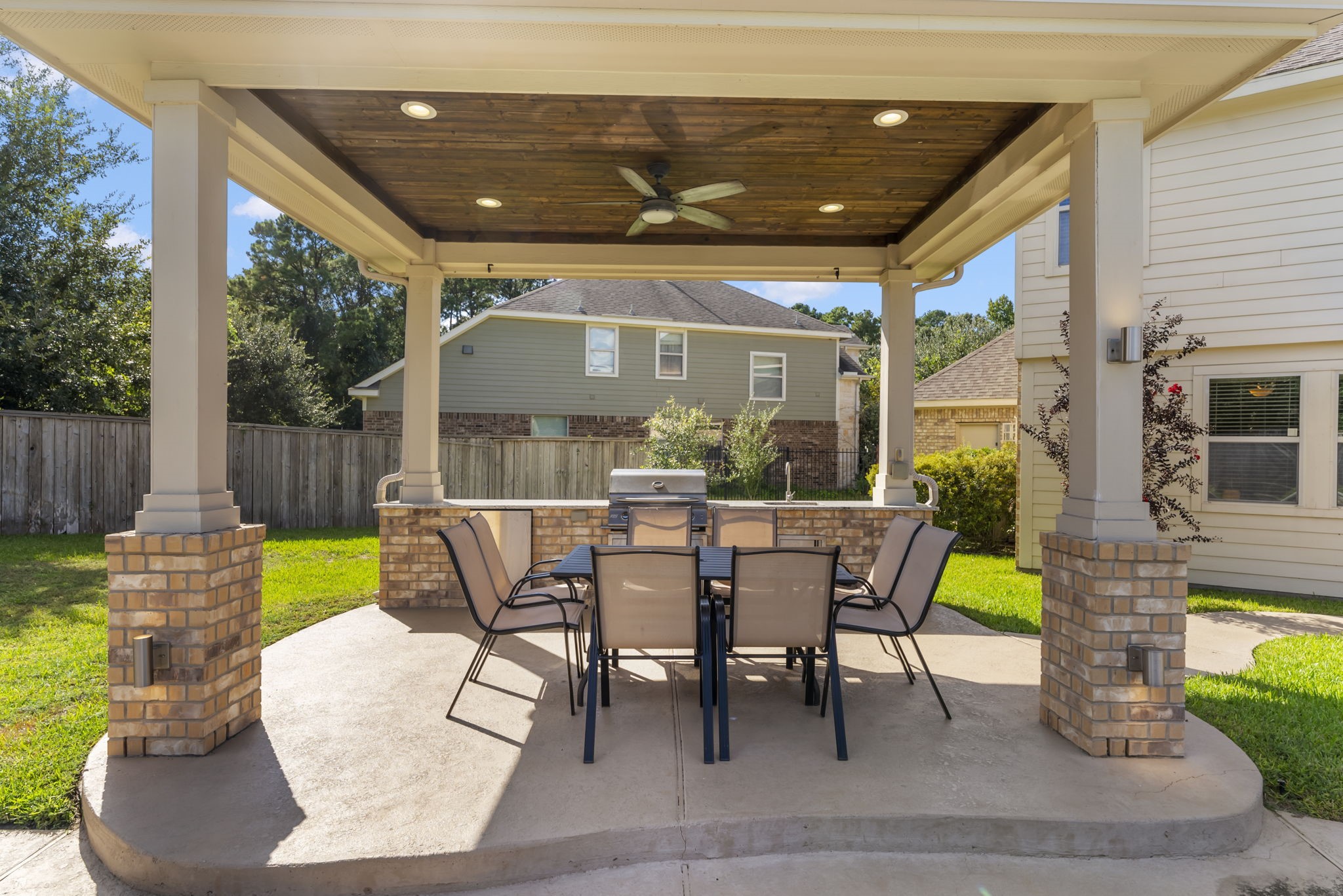 119 Wood Drake Place Tomball, TX 77375 - Photo 41 of 47 a view of a patio with a table chairs and a backyard