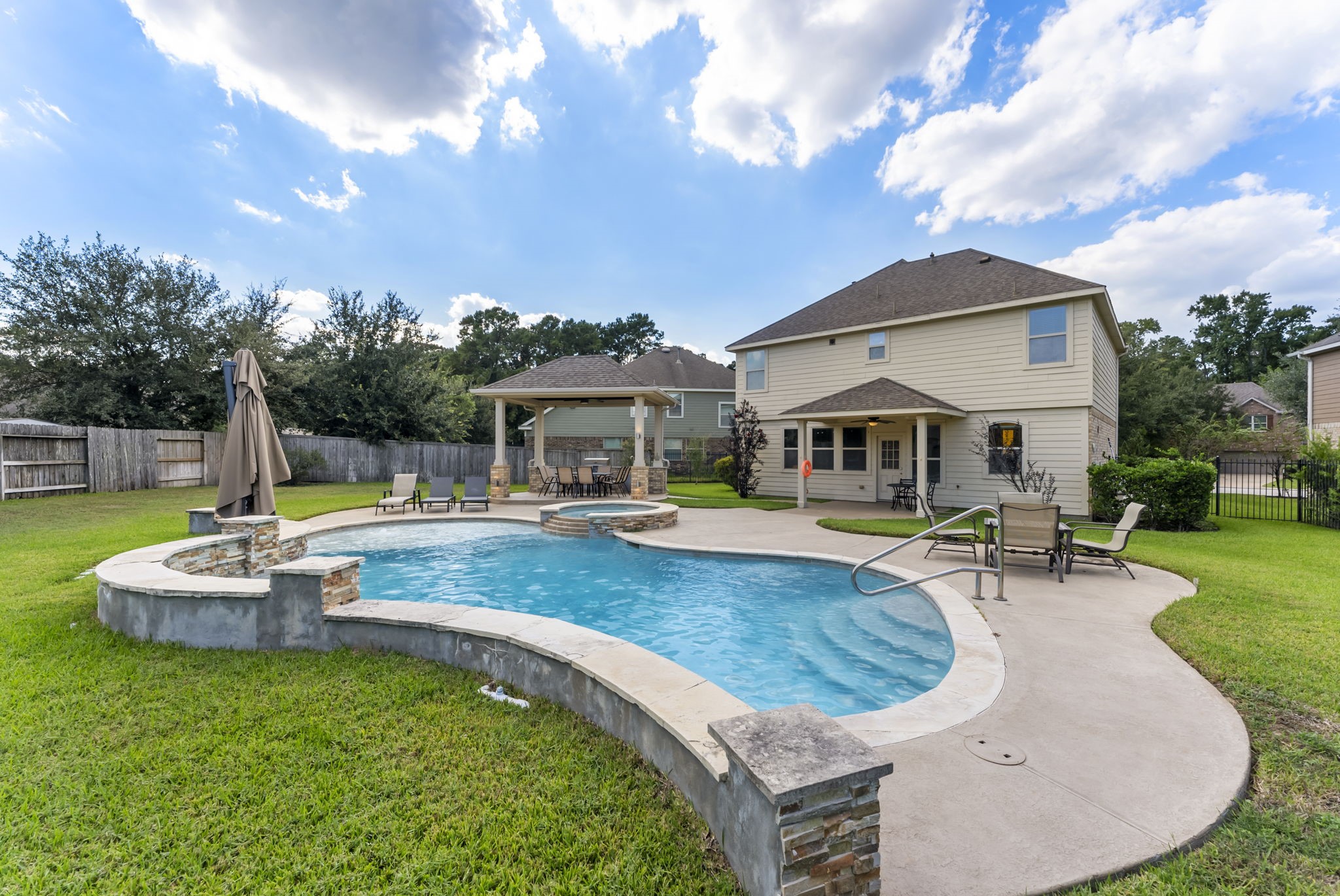 119 Wood Drake Place Tomball, TX 77375 - Photo 46 of 47 a view of a house with swimming pool and sitting area