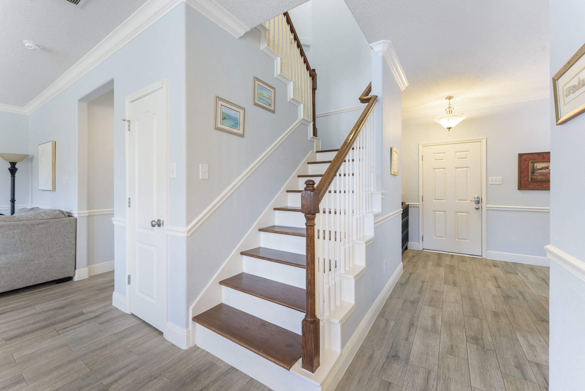 119 Wood Drake Place Tomball, TX 77375 - Photo 7 of 47 a view of a hallway view with wooden floor and staircase