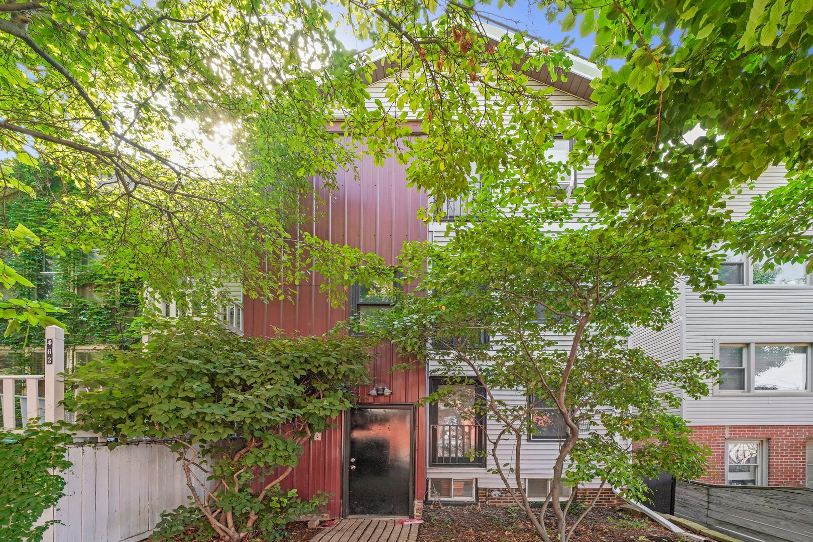 a view of a house with a tree