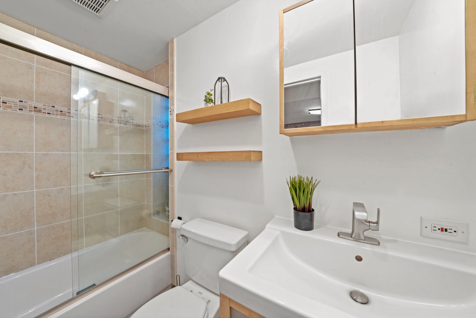 464 North Aberdeen Street, Unit 1R Chicago, IL 60642 - Photo 11 of 16 a bathroom with a sink a toilet and shower
