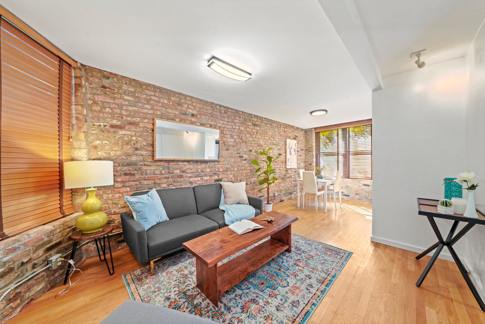 464 North Aberdeen Street, Unit 1R Chicago, IL 60642 - Photo 6 of 16 a living room with furniture and a rug