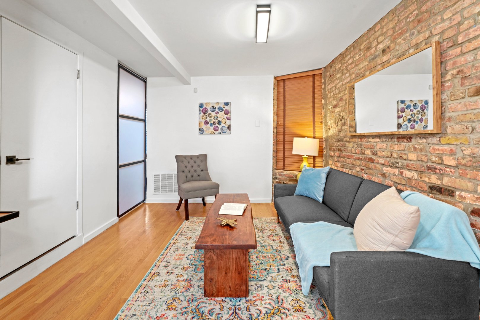 464 North Aberdeen Street, Unit 1R Chicago, IL 60642 - Photo 7 of 16 a living room with furniture and a rug