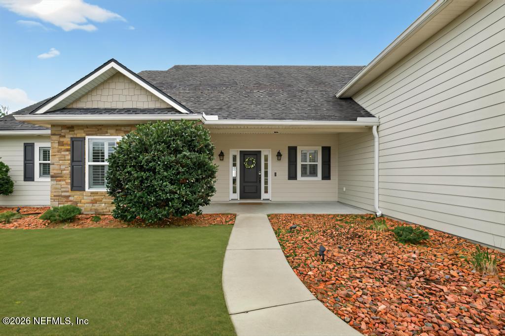 37575 Kings Ferry Road Hilliard, FL 32046 - Photo 13 of 83 a front view of a house with a yard and garage