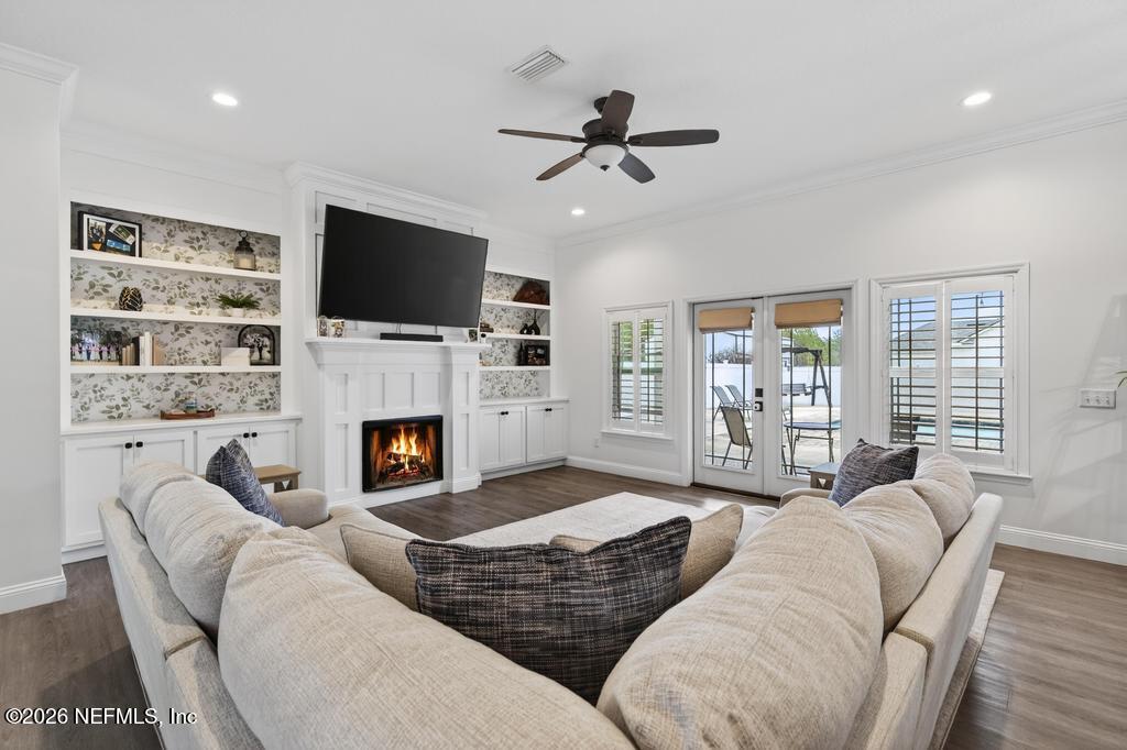 37575 Kings Ferry Road Hilliard, FL 32046 - Photo 17 of 83 a living room with furniture fireplace and a flat screen tv