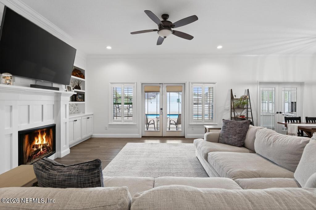 37575 Kings Ferry Road Hilliard, FL 32046 - Photo 18 of 83 a living room with furniture fireplace and flat screen tv