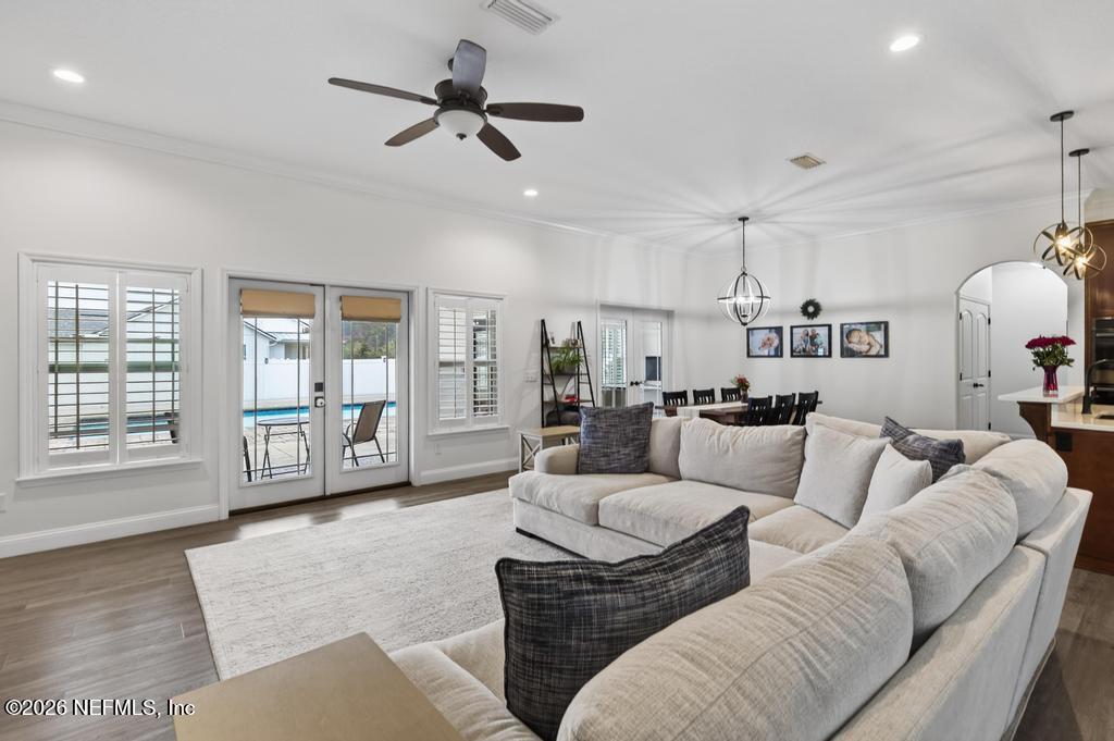 37575 Kings Ferry Road Hilliard, FL 32046 - Photo 19 of 83 a living room with furniture and a large window