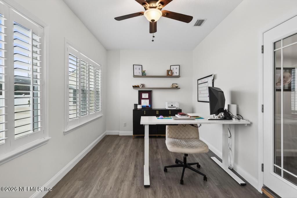 37575 Kings Ferry Road Hilliard, FL 32046 - Photo 27 of 83 a view of workspace with furniture window and wooden floor
