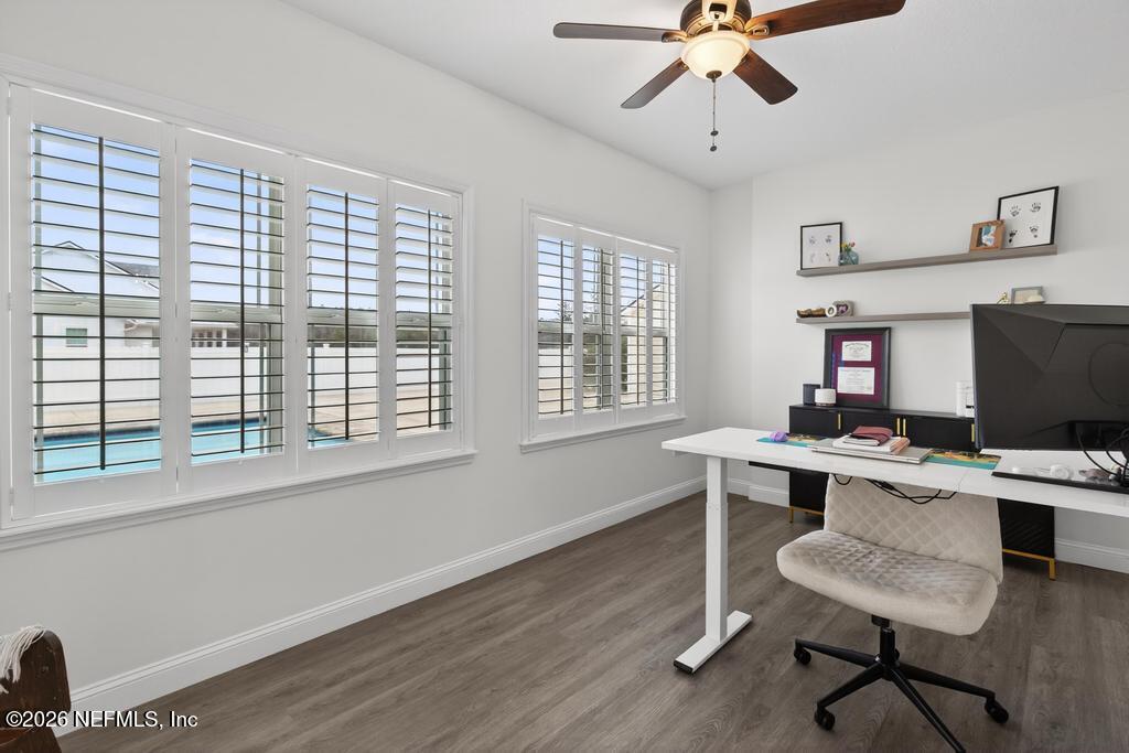 37575 Kings Ferry Road Hilliard, FL 32046 - Photo 28 of 83 a view of a workspace with furniture and a window