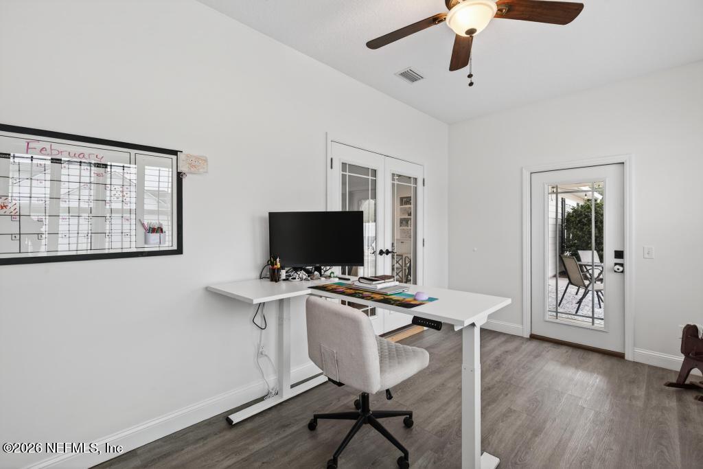 37575 Kings Ferry Road Hilliard, FL 32046 - Photo 30 of 83 a view of a workspace with furniture and a flat screen tv