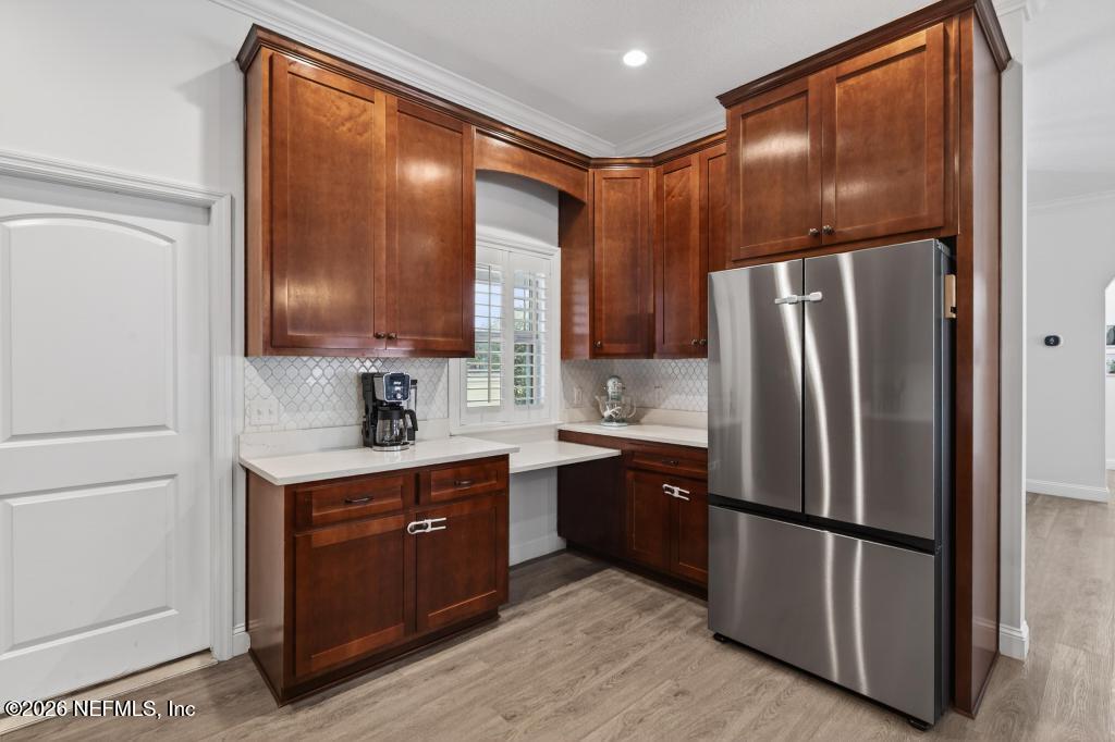 37575 Kings Ferry Road Hilliard, FL 32046 - Photo 37 of 83 a kitchen with stainless steel appliances granite countertop a refrigerator sink and cabinets