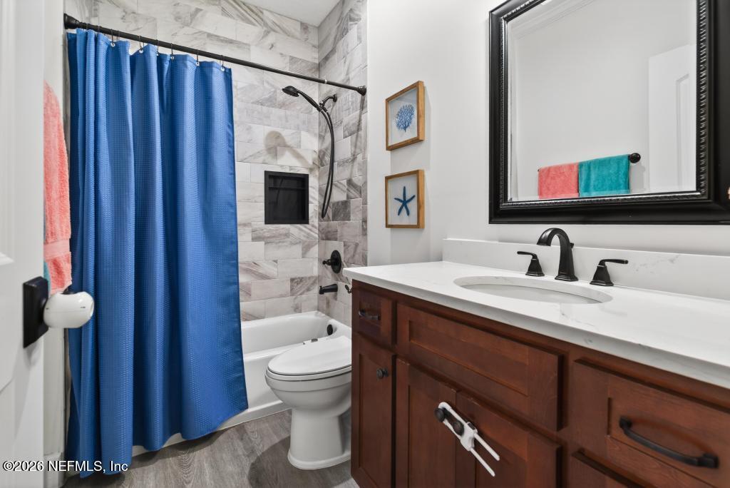 37575 Kings Ferry Road Hilliard, FL 32046 - Photo 44 of 83 a bathroom with a sink toilet and shower