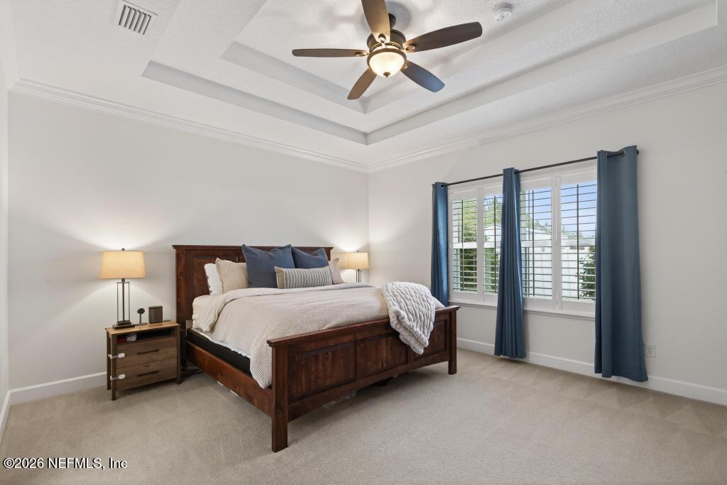 37575 Kings Ferry Road Hilliard, FL 32046 - Photo 55 of 83 a bed room with a bed and a ceiling fan