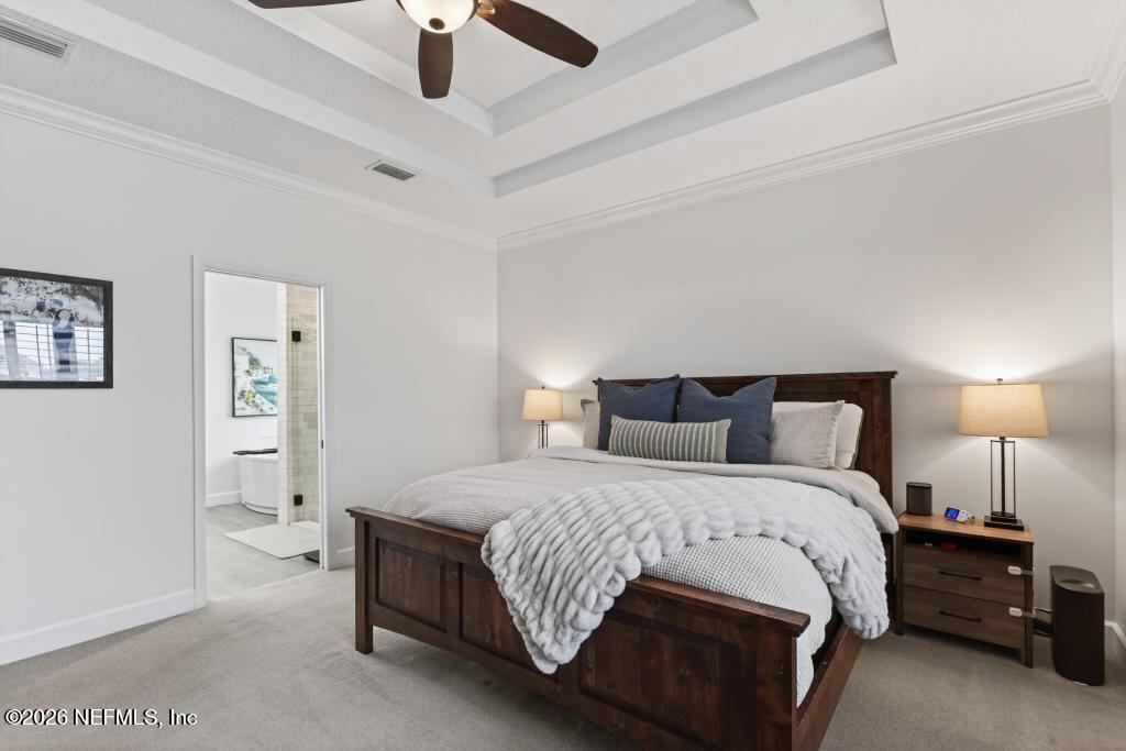 37575 Kings Ferry Road Hilliard, FL 32046 - Photo 57 of 83 a bedroom with a bed and a lamp on table