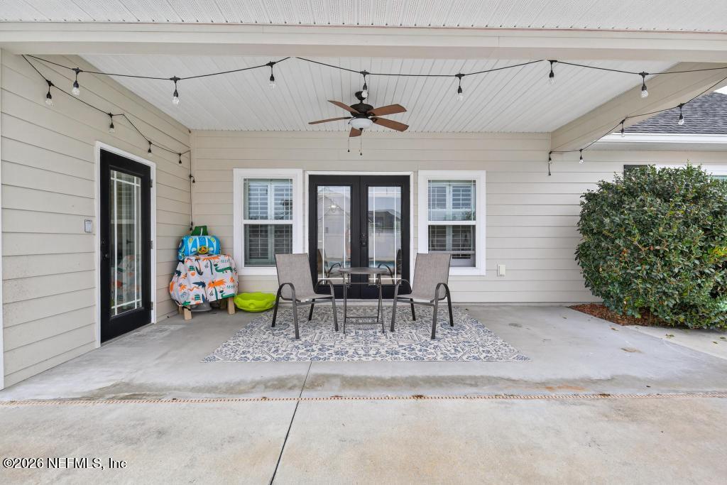 37575 Kings Ferry Road Hilliard, FL 32046 - Photo 66 of 83 a view of a dining room with furniture and a potted plant