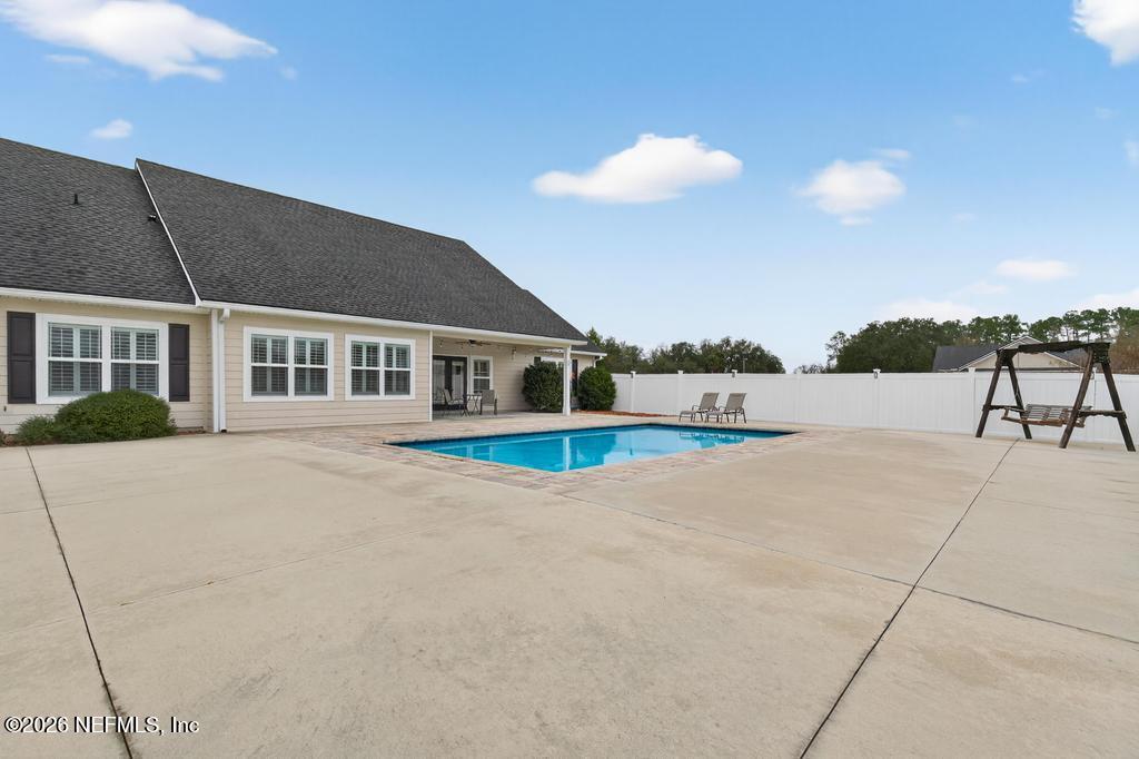 37575 Kings Ferry Road Hilliard, FL 32046 - Photo 70 of 83 a view of a house with a yard and sitting area