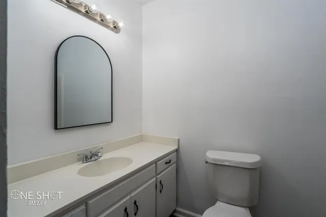 a bathroom with a sink and a toilet