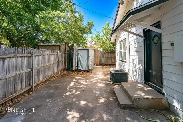 a view of a back yard from a patio