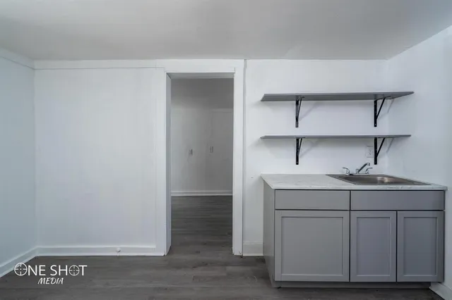 a view of cabinets with wooden floor