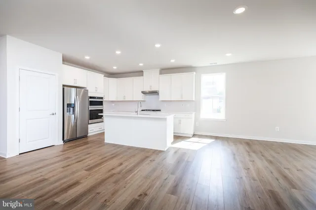 a view of kitchen with wooden floor