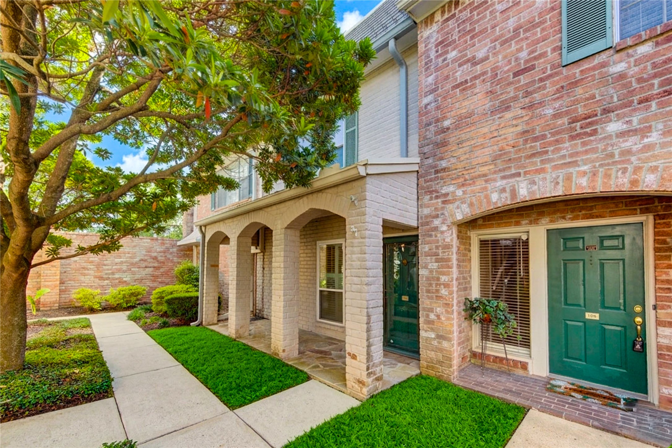 2232 South Piney Point Road, Unit 110 Houston, TX 77063 - Photo 2 of 21 Charming front entry with mature landscaping, covered walkway, and welcoming curb appeal in a peaceful gated community. ALL UTILITIES INCLUDED!