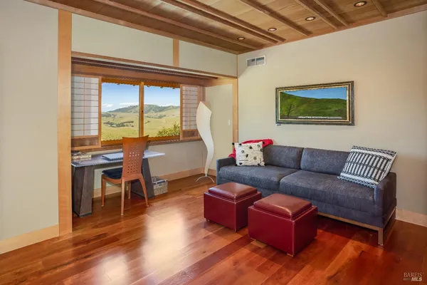a living room with furniture and a large window