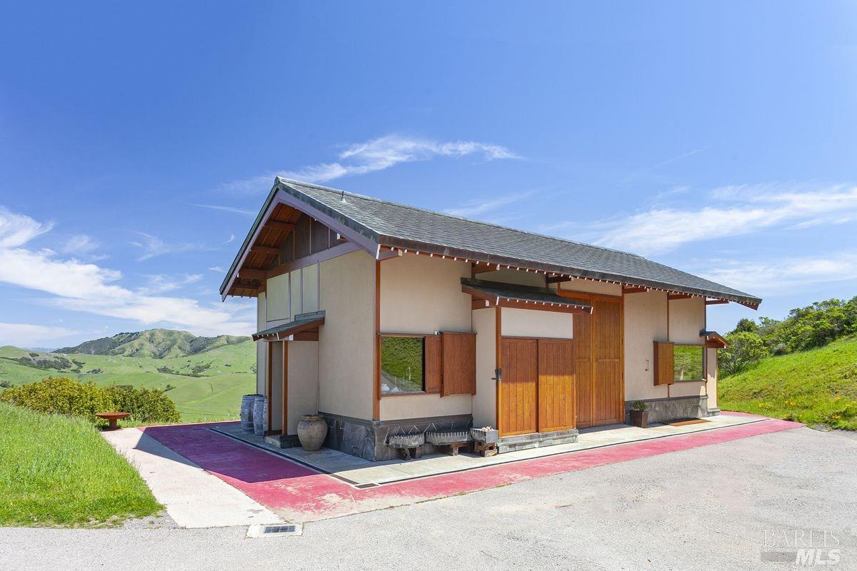 333-345 Willow Road Nicasio, CA 94946 - Photo 24 of 44 a front view of a house with a yard