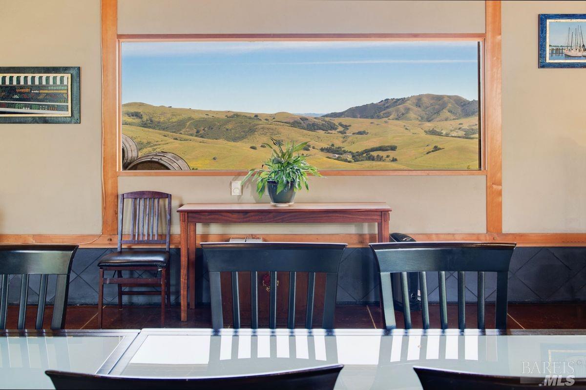 333-345 Willow Road Nicasio, CA 94946 - Photo 26 of 44 a view of a balcony with a table and chairs