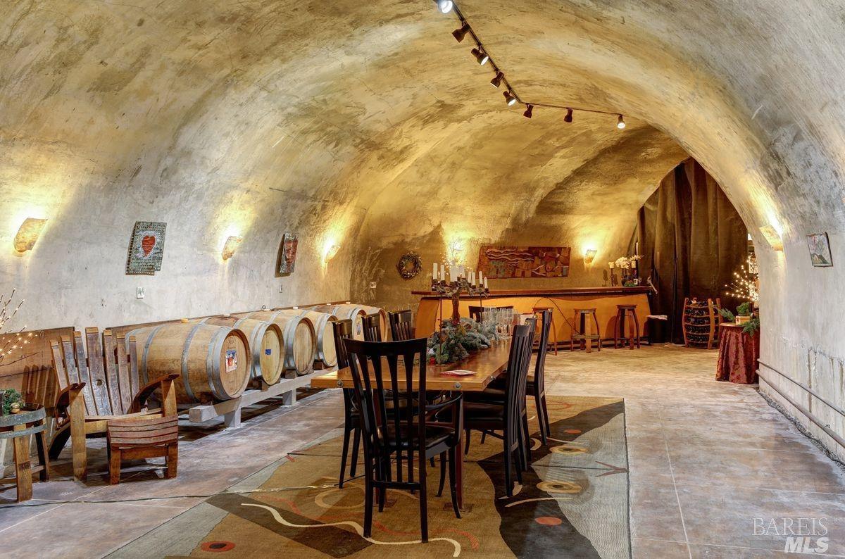 333-345 Willow Road Nicasio, CA 94946 - Photo 29 of 44 a view of a patio with table and chairs with wooden floor and fence