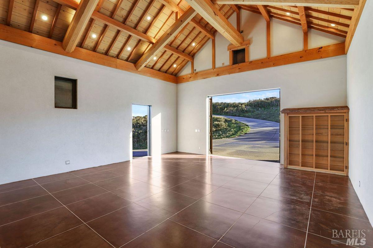 333-345 Willow Road Nicasio, CA 94946 - Photo 38 of 44 a view of an empty room with wooden floor and a window