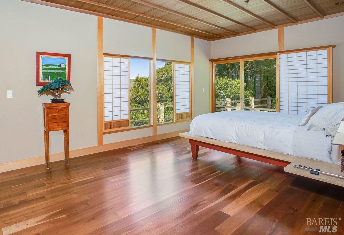 333-345 Willow Road Nicasio, CA 94946 - Photo 10 of 44 a spacious bedroom with a bed and a large window with outer view